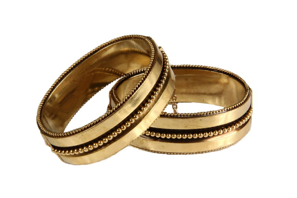 PR BRACELETS - Pair of Victorian14K Yellow Gold Hinged: PR BRACELETS - Pair of Victorian14K Yellow Gold Hinged Cuff Bracelets with applied beaded decoration at center and on edges, with safety chains. Unmarked, but test for 14K. 3/4" wide, inner dimensions