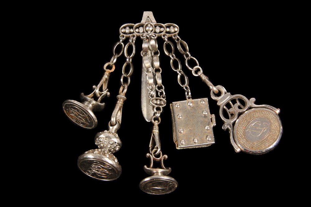 CHATELAINE - Late 18th - early 19th c. Cut Steel: CHATELAINE - Late 18th - early 19th c. Cut Steel Chatelaine with (5) engraved seals and (1) leather folio book. With faceted cut steel decoration at top. 4 3/8" long (3 1/2" long without seals), 1 3/8