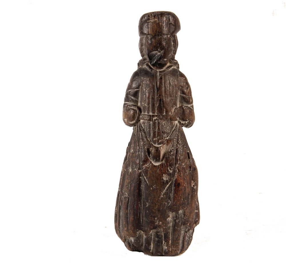 GOTHIC SCULPTURAL FRAGMENT - Carved Hardwood Figure of: GOTHIC SCULPTURAL FRAGMENT - Carved Hardwood Figure of a Standing Burgermeister, quite worn, but also chattered and scorched, the face intentionally disfigured. A relic of war, 10 1/2" tall.