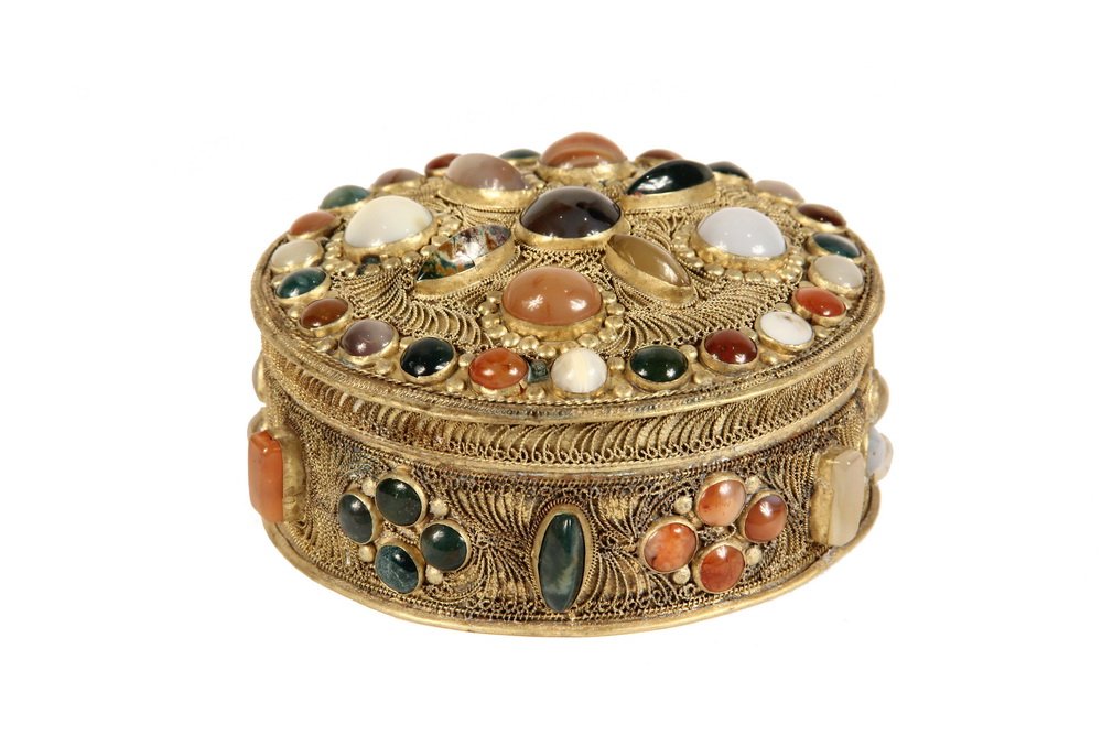 ANGLO-INDIAN KEEPSAKE BOX - Mughal Style Round Gilt: ANGLO-INDIAN KEEPSAKE BOX - Mughal Style Round Gilt Brass Box encrusted with a variety of semi-precious stone cabochon mounts surrounded by twisted wirework scrolls, the slightly domed lid with overha
