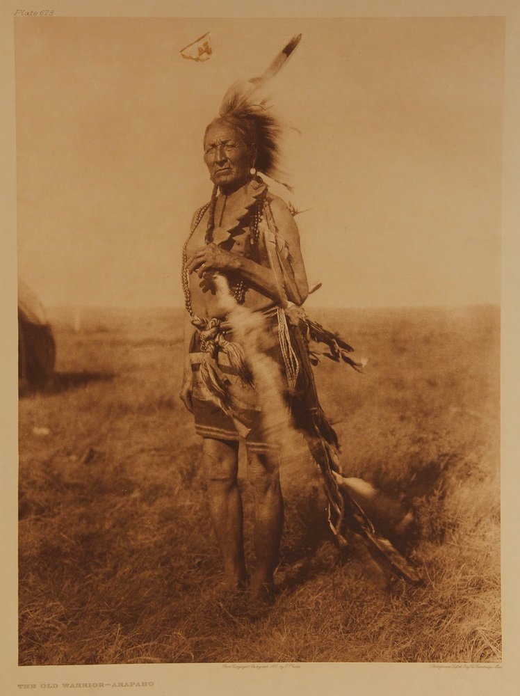 EDWARD SHERIFF CURTIS (WA/CA/WI, 1868-1952) - Large: EDWARD SHERIFF CURTIS (WA/CA/WI, 1868-1952) - Large Folio Photogravure: "The Old Warrior, Arapaho", plate 673, 1927, matted, unframed, 22" x 18" full sheet with deckled edges, 17 1/4" x 12 3/4" impres