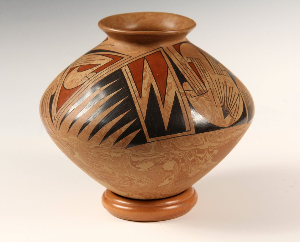 NATIVE AMERICAN POT - Casas Grandes Red & Black on: NATIVE AMERICAN POT - Casas Grandes Red & Black on Variegated Clay by Oscar Quesada, Village of Juan Mata Ortiz, Chihuahua, Mexico. Signed. 6 3/4" x 7 1/2" diam. Fine condition.