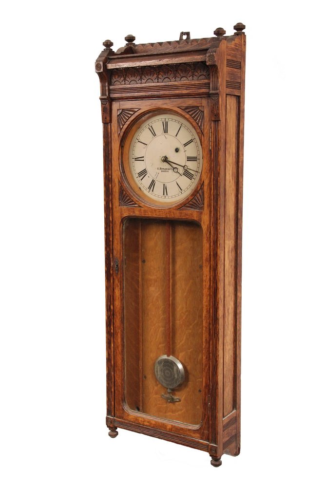 REGULATOR CLOCK - E. Howard #58, Boston, in oak case: REGULATOR CLOCK - E. Howard #58, Boston, in oak case with gallery, pressed detail, 8" metal dial, damascened pendulum. 8 day time only brass movement. 39 1/2" x 12 1/2" x 5 1/2." Good condition, minor