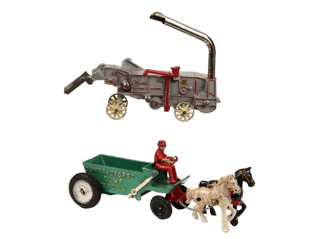 (2) CAST IRON TOYS - Both by Arcade Mfg Co of Freeport,: (2) CAST IRON TOYS - Both by Arcade Mfg Co of Freeport, IL, including: 1920s McCormick-Deering Wheat Thresher, all original, with decal, 11 1/2" long; PLUS 1930s Contractor's Dump Wagon with hard-rubb