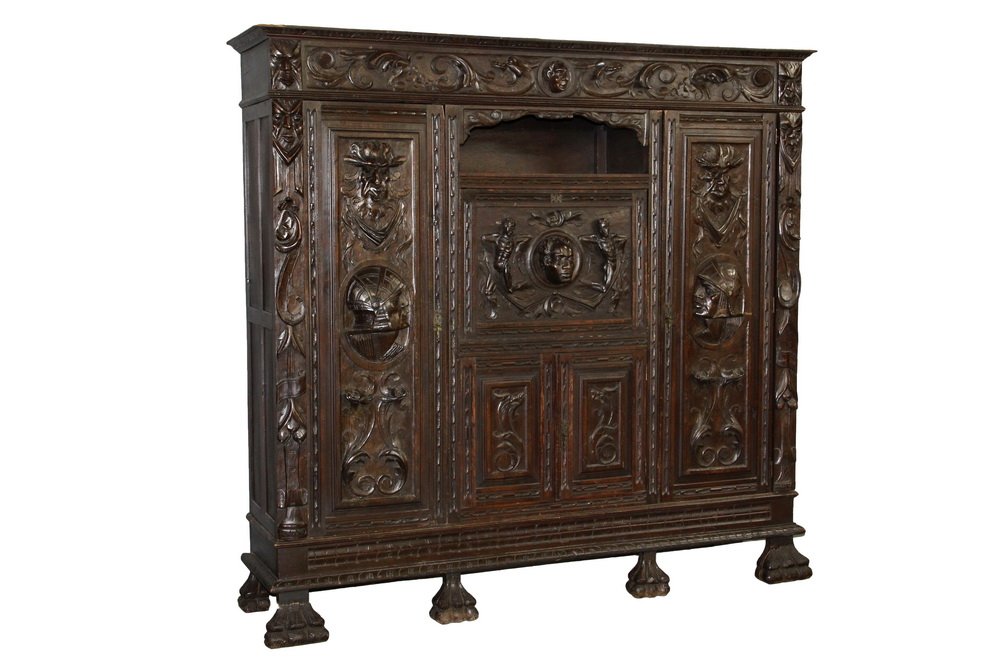 EUROPEAN CARVED SECRETARY - Heavily Carved Dark Walnut: EUROPEAN CARVED SECRETARY - Heavily Carved Dark Walnut Renaissance Revival Cabinet, probably German, circa 1920, knock-down, having a molded cornice above the frieze which features scrollwork acanthus