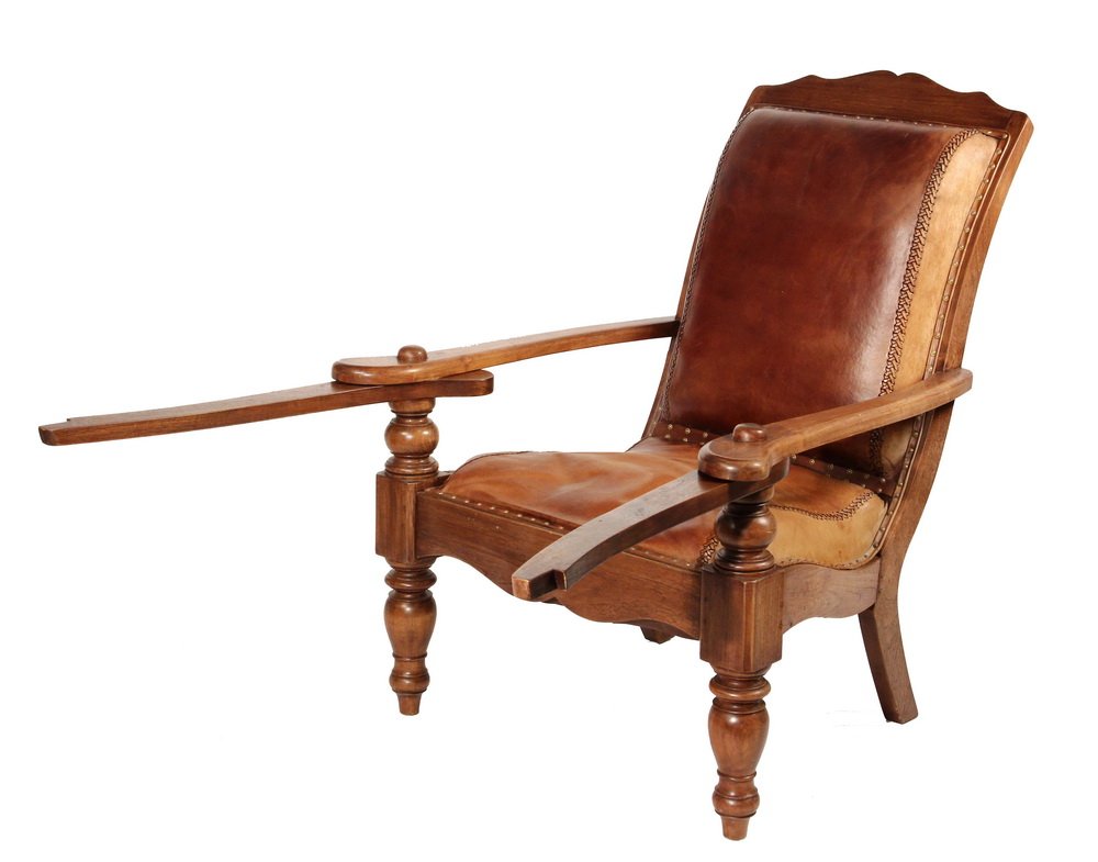 PLANTATION ARMCHAIR - British Colonial Island Veranda: PLANTATION ARMCHAIR - British Colonial Island Veranda Chair in mahogany with brown leather laced and brass tacked upholstery, having swing-out arms for use as leg rests. 20th c. 17" seat, 25 1/2" arm,