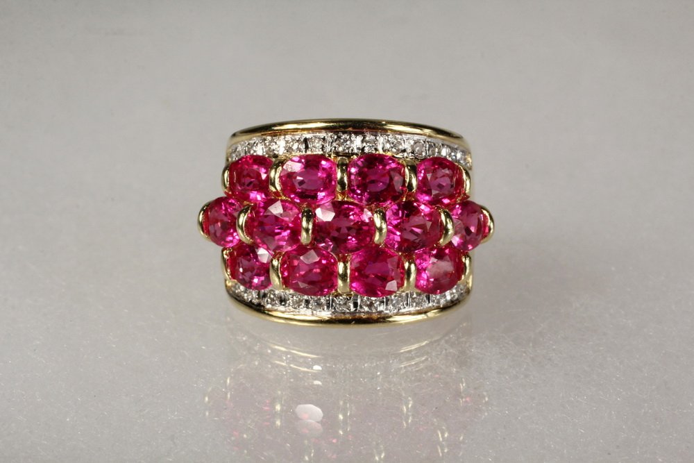 LADY'S RING - 18K Yellow Gold, Pink Sapphire and: LADY'S RING - 18K Yellow Gold, Pink Sapphire and Diamond Lady's Ring, set with (13) round pink sapphires with rows of diamonds above and below, Size 6 1/2, 9.6 dwt tw.