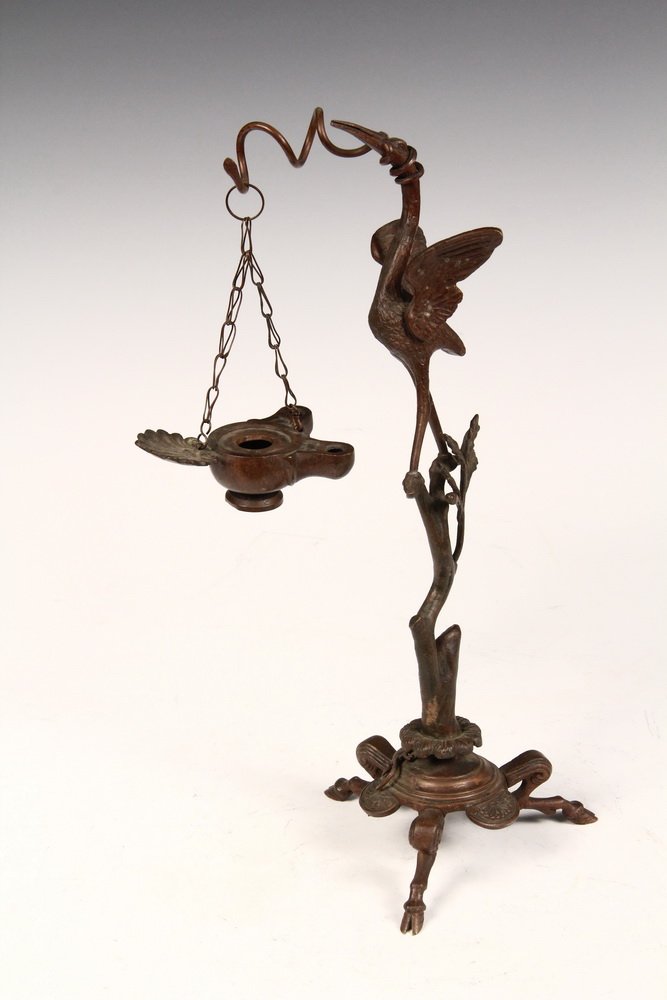 BRONZE GREASE LAMP - French Empire Period Desk Lamp in: BRONZE GREASE LAMP - French Empire Period Desk Lamp in Egyptian Revival form, the two-stem lamp suspended by chain from a coiled snake emanating from the head of an ibis standing on a shattered branch
