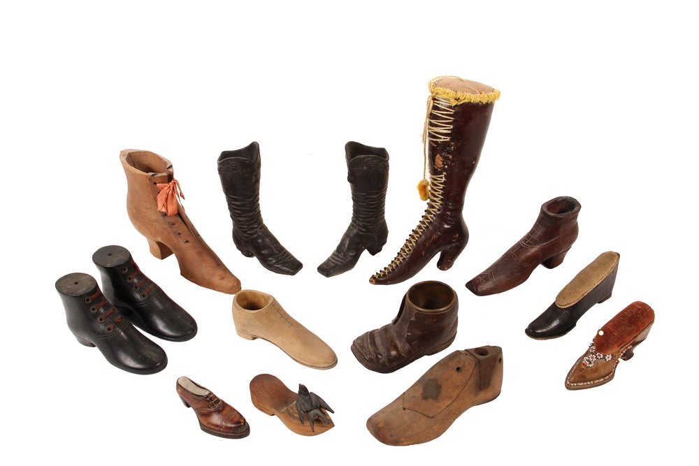 (14) MINIATURE LEATHER OR WOOD SHOES - 19th - 20th c,: (14) MINIATURE LEATHER OR WOOD SHOES - 19th - 20th c, including: Leather Knee-High Woman's Boot as Pincushion, 8 1/2" tall; PLUS Carved Pine Woman's Boot, 6 1/2" long; PLUS Pair of Carved Ebony Men's