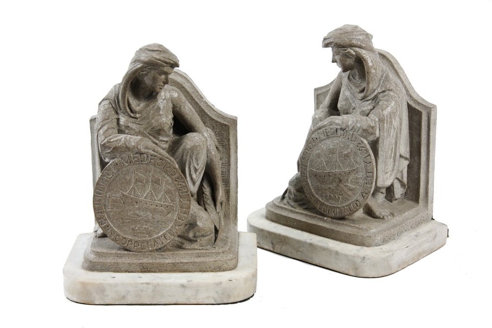 CARVED SANDSTONE FIGURAL BOOKENDS - Medford,: CARVED SANDSTONE FIGURAL BOOKENDS - Medford, Massachusetts commemorative allegorical figures holding town shield, signed 'E. Latorella' and marked '1936, Project GJ', probably a WPA Project production