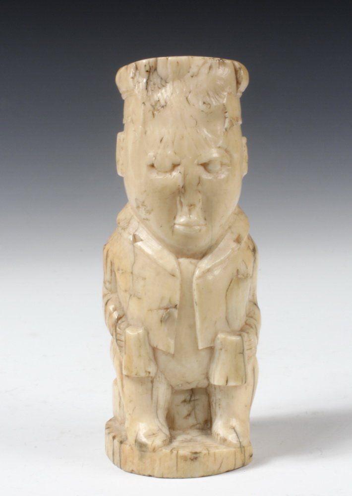 18TH C AFRICAN BONE CARVING OF A EUROPEAN - Perhaps: 18TH C AFRICAN BONE CARVING OF A EUROPEAN - Perhaps Congolese, showing a European gent seated on a low stool holding two tankards. Nice patina. Old losses to face and head, 4" high. From the Marvin Sa