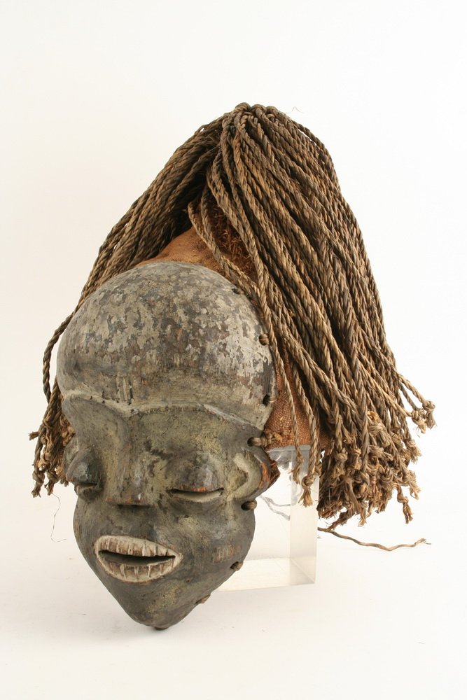 AFRICAN MASK - Pende Tribe, Imitation Rites of Secret: AFRICAN MASK - Pende Tribe, Imitation Rites of Secret Society (now Dem Rep of Congo), carved wood with cloth headdress and raffia hair, hooded eyes, bared teeth, large domed forehead, 9 1/2" tall. Goo
