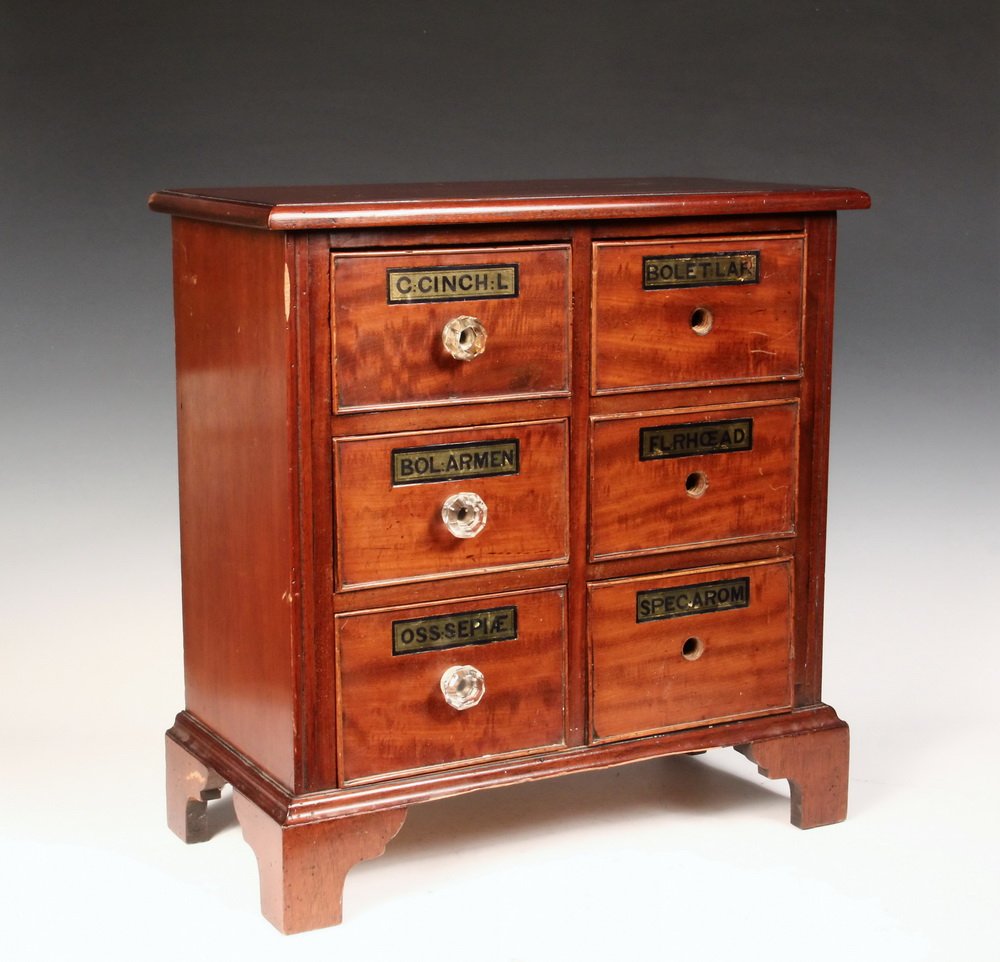 ENGLISH APOTHECARY CABINET - Mid 19th c. Mahogany: ENGLISH APOTHECARY CABINET - Mid 19th c. Mahogany Six-Drawer Countertop Dresser Form Cabinet, having an overhanging molded top, pairs of graduated beaded edge drawers (only three with the original gla