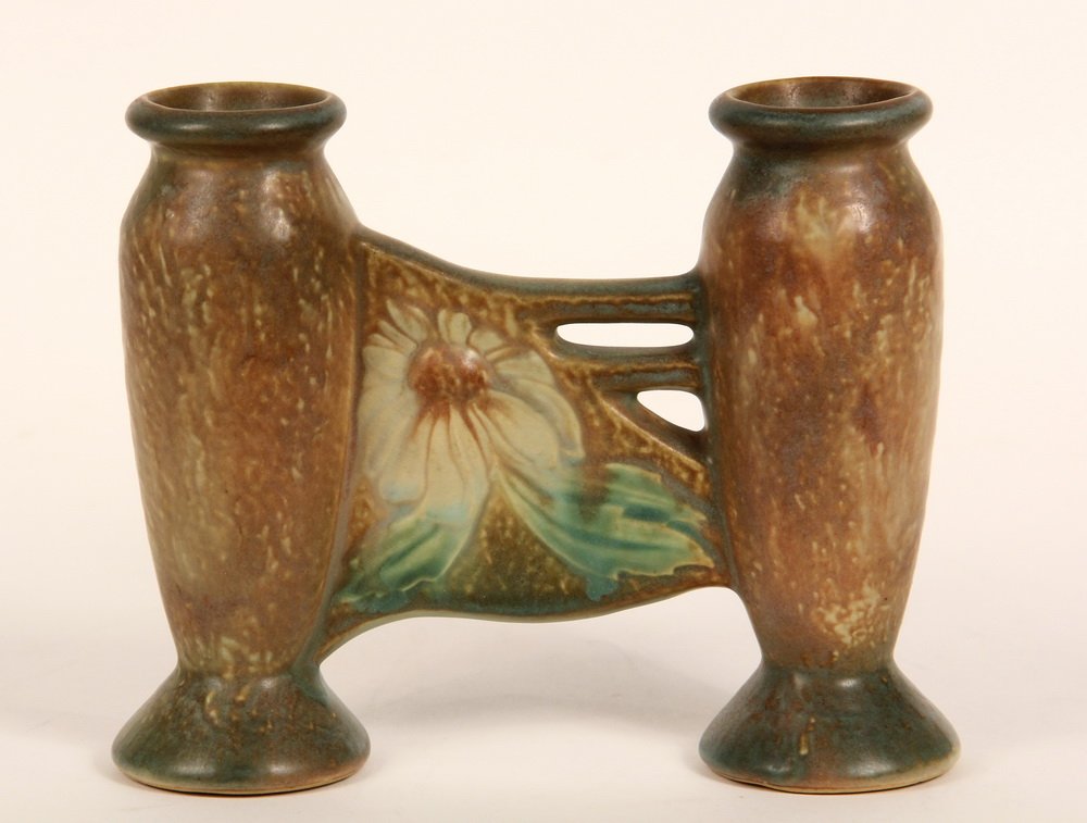 ART POTTERY VASE - Roseville Pottery Dahlrose Double: ART POTTERY VASE - Roseville Pottery Dahlrose Double Bud Vase, shape 79, 6", in umber, circa 1920, unmarked, would have had a paper label. 6 1/2" x 7 1/2" x 2". Fine condition.