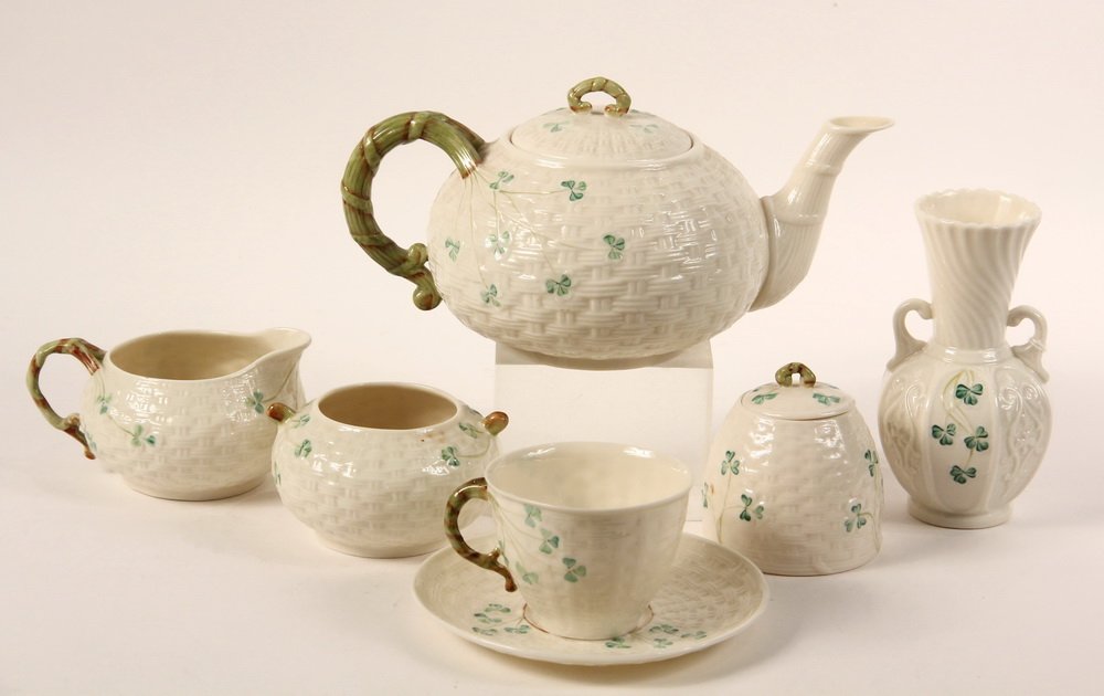 (19 PC) BELLEEK TEA SET - Irish Belleek Transluscent: (19 PC) BELLEEK TEA SET - Irish Belleek Transluscent Porcelain in basketweave and shamrock pattern, green marks, mid-20th c, including: 6" Teapot; Sugar & Open Creamer; Covered Honey Pot; 6" Vase; (8)
