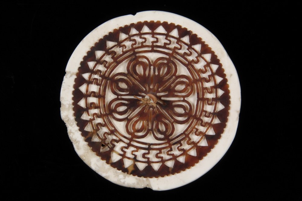 POLYNESIAN SHELL ORNAMENT - Shell Disk overlaid with: POLYNESIAN SHELL ORNAMENT - Shell Disk overlaid with hand cut filigree turtle shell, Solomon Islands. Commonly known as kapkaps, they were worn westward to New Ireland and on into the Papuan Gulf. 4 1