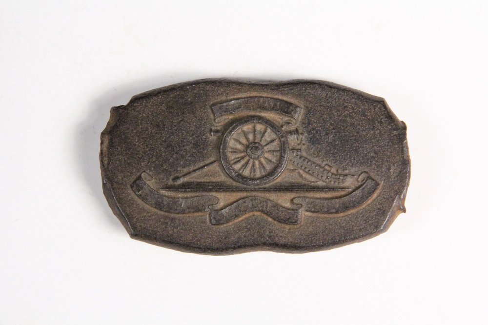 CAST IRON RELIEF - British 19th c, depicting an: CAST IRON RELIEF - British 19th c, depicting an artillery piece, objects such as this were used in the manufacture of stamped brass regimental badges.1 7/8" x 3 1/4". From the Marvin Sadik Collection.