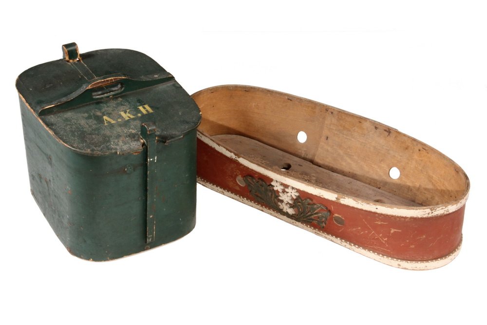 (2) FOLK ART PAINTED CARRIERS - 19th c. New England: (2) FOLK ART PAINTED CARRIERS - 19th c. New England Food Carrier in green painted bent softwood with locking top having handle, initials "A.K.H.", 12 1/2" x 16" x 12"; PLUS Scandinavian Baby Carrier i