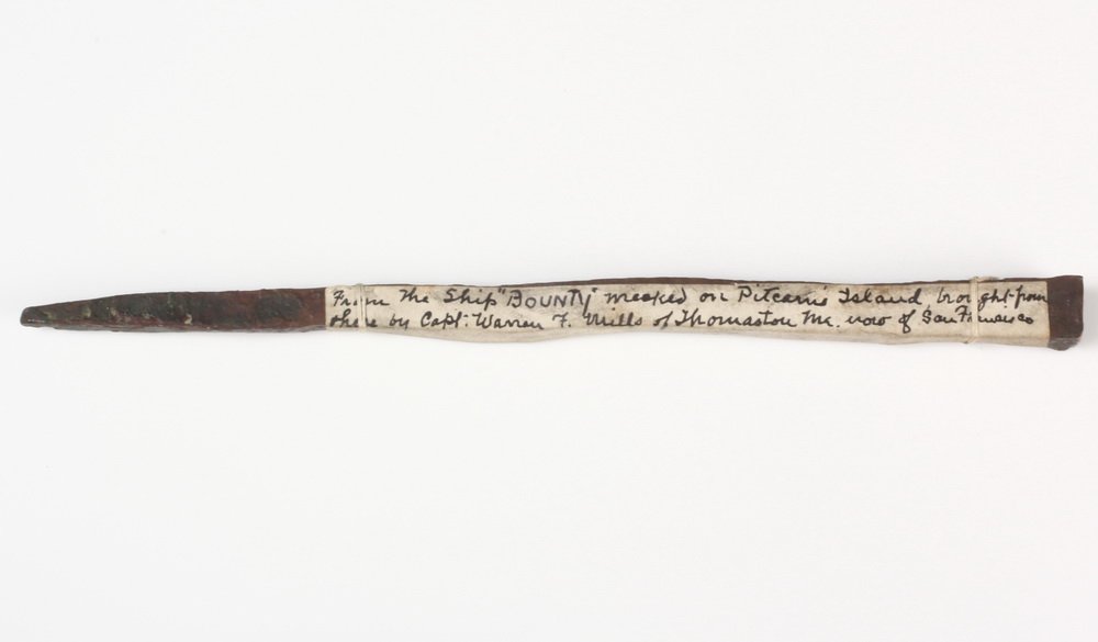 H.M.S. BOUNTY BRONZE NAIL - Hammered Bronze Spike: H.M.S. BOUNTY BRONZE NAIL - Hammered Bronze Spike bearing an old label " From the ship 'BOUNTY' wrecked on Pitcairn Island brought from there by Capt. Warren F. Mills of Thomaston, Me, now of San Fran