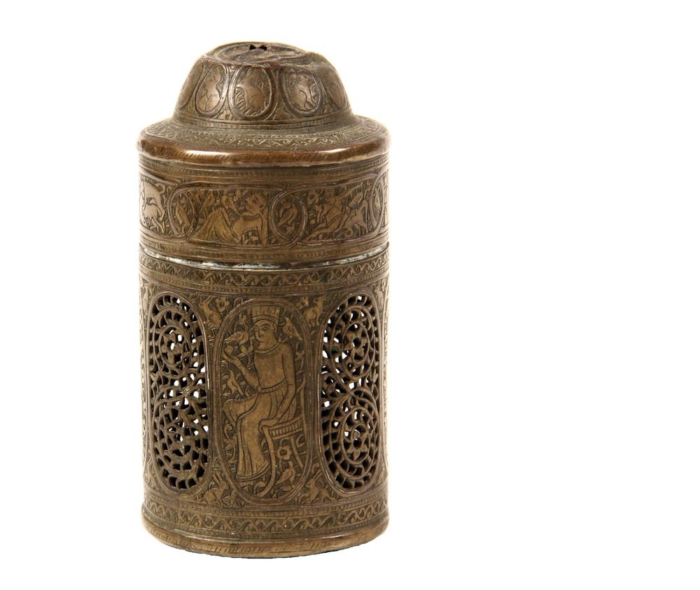 EARLY PERSIAN BRASS BOX - Cylindrical Sachet / Cricket: EARLY PERSIAN BRASS BOX - Cylindrical Sachet / Cricket Box, with domed friction fit lid, pierced for chain, overall fine chased decoration of figures and vinery, the body with pour pierce work lozenge