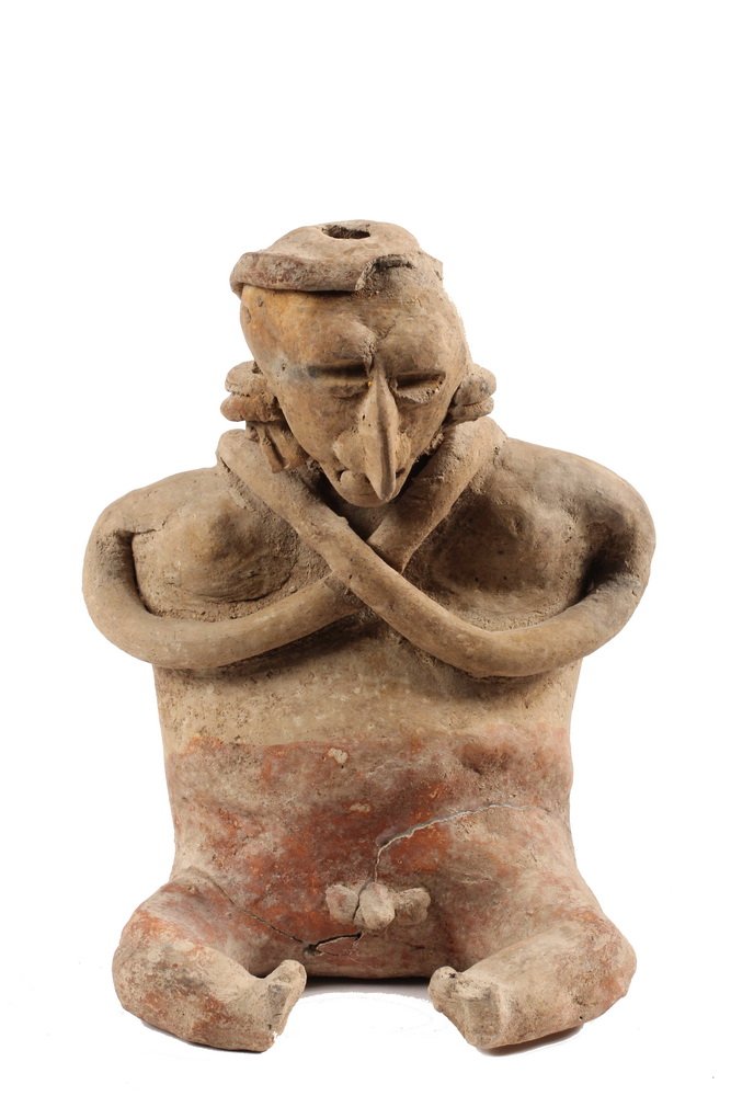 PRE-COLUMBIAN POTTERY FIGURE - Mayan Seated Offeratory: PRE-COLUMBIAN POTTERY FIGURE - Mayan Seated Offeratory Figure of a man with arms crossed at neck, earrings, headdress with long knotted tail at back, exposed genitals, curled legs, in remnants of pain