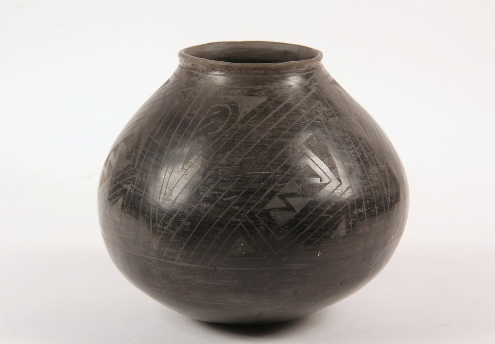 NATIVE AMERICAN POTTERY - Signed Blackware Olla, Mata: NATIVE AMERICAN POTTERY - Signed Blackware Olla, Mata Ortiz, Mexico, with incised matte decoration on striated polished clay, coil built, with low flared rim. 7 1/2" x 7 3/4" diam. Good condition.