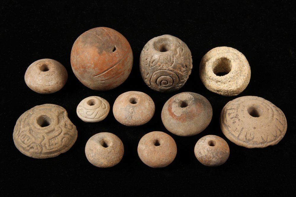 PRE-COLUMBIAN POTTERY - (11) Spinning Weight Beads &: PRE-COLUMBIAN POTTERY - (11) Spinning Weight Beads & (1) Ball-Form Rattle, most with incised decoration, most appear to be Mayan.
