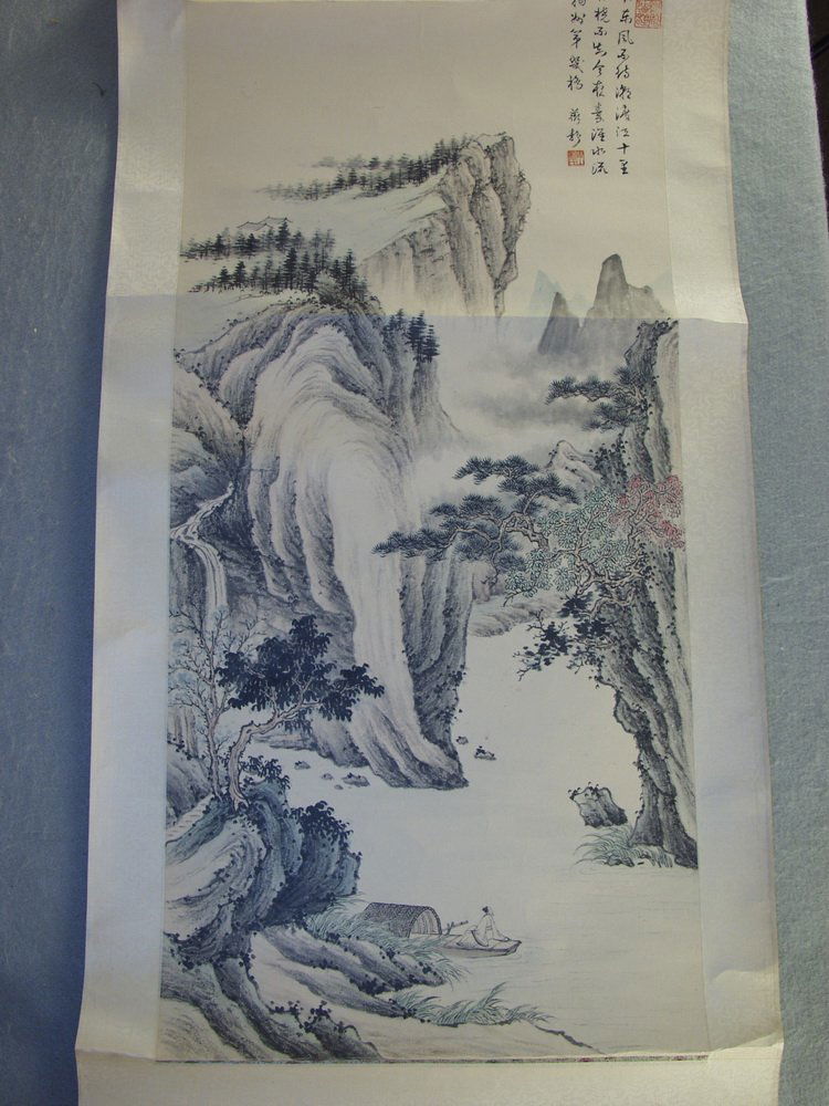 JAPANESE SUMI SCROLL - Ink Drawing with color of: JAPANESE SUMI SCROLL - Ink Drawing with color of bucolic scene with man in boat at foot of cliffs, signed and sealed, on silk scroll with ebonized roller, SS: 14 1/2" (36.8 cm) x 33" (83.8 cm), Horizo