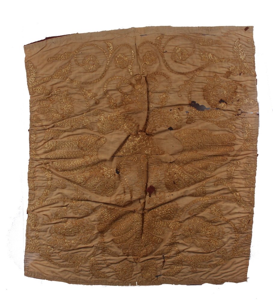 EARLY TEXTILE - Remnants of a Flag or Banner bearing: EARLY TEXTILE - Remnants of a Flag or Banner bearing the image of a heraldic double headed eagle. Possibly Russian 18th century, 27" x 22". Silk, stitched to a fine linen support. From the Marvin Sadi
