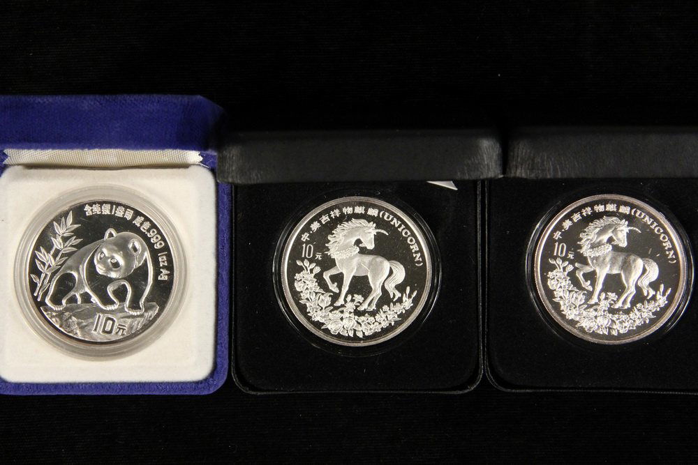 COINS - (3) China Coins include: (1) 1994 Silver Panda (1 of 1)
