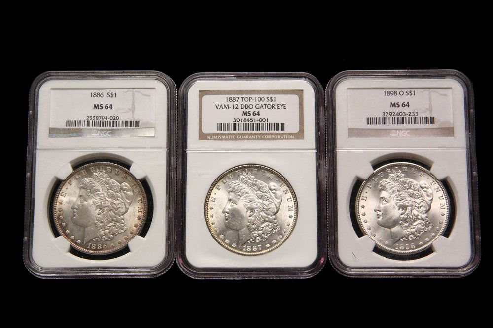 COINS - (3) Morgan Dollars: (1) 1898-O, NGC MS-64; (1) (1 of 2)
