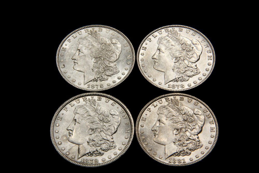 COINS - (4) Morgan Dollars include: (1) 1878 7/TF; 1879; (1 of 2)