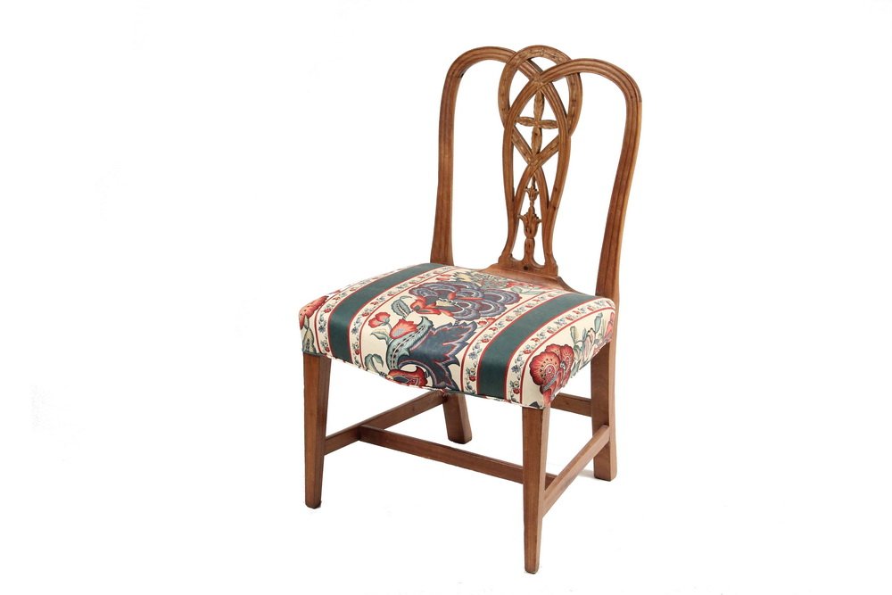 CARVED BACK HEPPLEWHITE SIDECHAIR - Fine mahogany: CARVED BACK HEPPLEWHITE SIDECHAIR - Fine mahogany example having looped open back with carved foliate and blossom motif. Serpentine front seat set on square tapered legs. 35 Â½" H x 22" W x 19" D. S