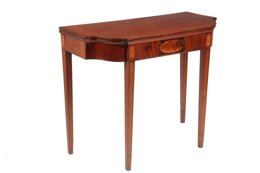 CARD TABLE - Inlaid Mahogany Hepplewhite Gaming Table: CARD TABLE - Inlaid Mahogany Hepplewhite Gaming Table with stepped front and cyma ends, string inlaid with central oval cartouche on the conforming skirt, rectangular panels at the top of the inlaid s