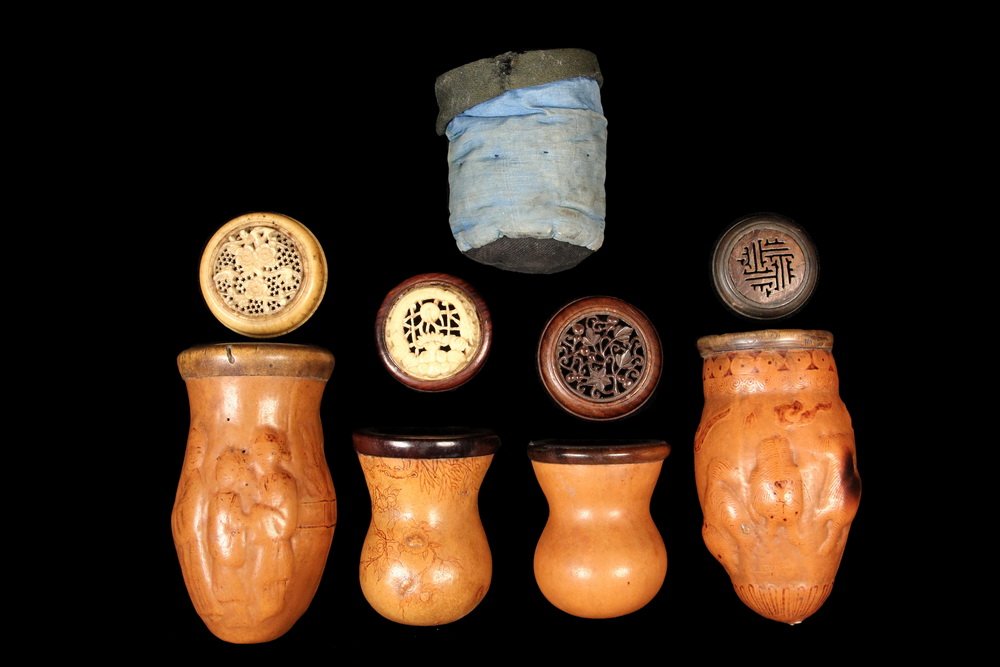 (4) CRICKET GOURDS - 19th c. Chinese Cricket Cages in: (4) CRICKET GOURDS - 19th c. Chinese Cricket Cages in molded gourds with reticulated rosewood and/or bone caps, the sides of the gourds having raised figures of courting couples on one, foo dogs with 