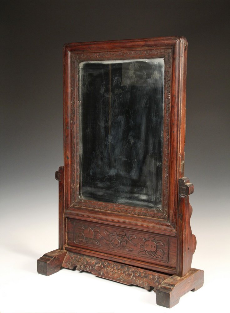 CHINESE TABLE MIRROR - 19th c. Standing Mirror with: CHINESE TABLE MIRROR - 19th c. Standing Mirror with relief carved rosewood loose frame and separate stand, featuring plums and buddha hand in frieze, lingxhi and central dragon head on canted skirt, w