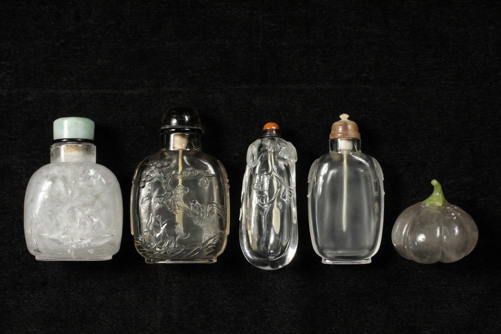 A GROUP OF (5) ROCK CRYSTAL SNUFF BOTTLES - Including:: A GROUP OF (5) ROCK CRYSTAL SNUFF BOTTLES - Including: A Carved Rock Crystal "Figure in Landscape" Snuff Bottle with pale green jade cap, 19th c., 2 3/4"; PLUS A Carved Rock Crystal "Horse and Monkey"