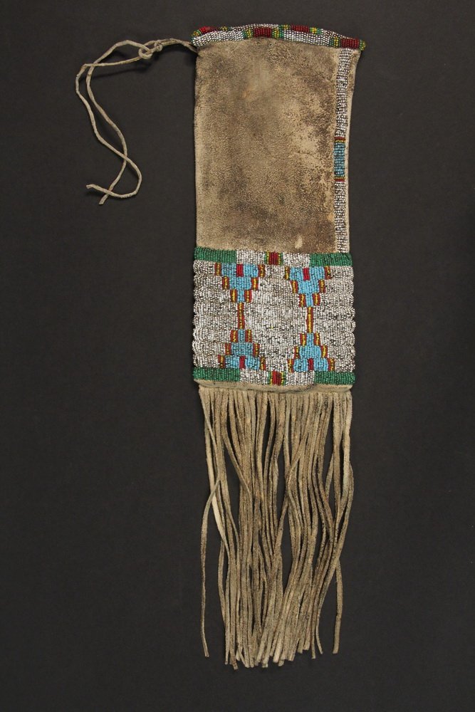 NATIVE AMERICAN BEADED TOBACCO BAG - Plains Indian: NATIVE AMERICAN BEADED TOBACCO BAG - Plains Indian Two-Sided Deer Hide Bag with Fringe, late 19th c, with seed glass beadwork decoration on both sides in red, pale green and pale blue on white geometr