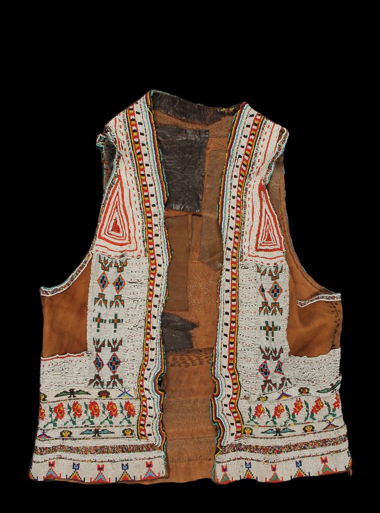 NATIVE AMERICAN BEADED VEST - Early 20th c. Plains: NATIVE AMERICAN BEADED VEST - Early 20th c. Plains Indian Deerskin Vest with glass bead decoration on white ground, featuring a six-sided star on back, border bands in ranks of tipis, people, birds, p