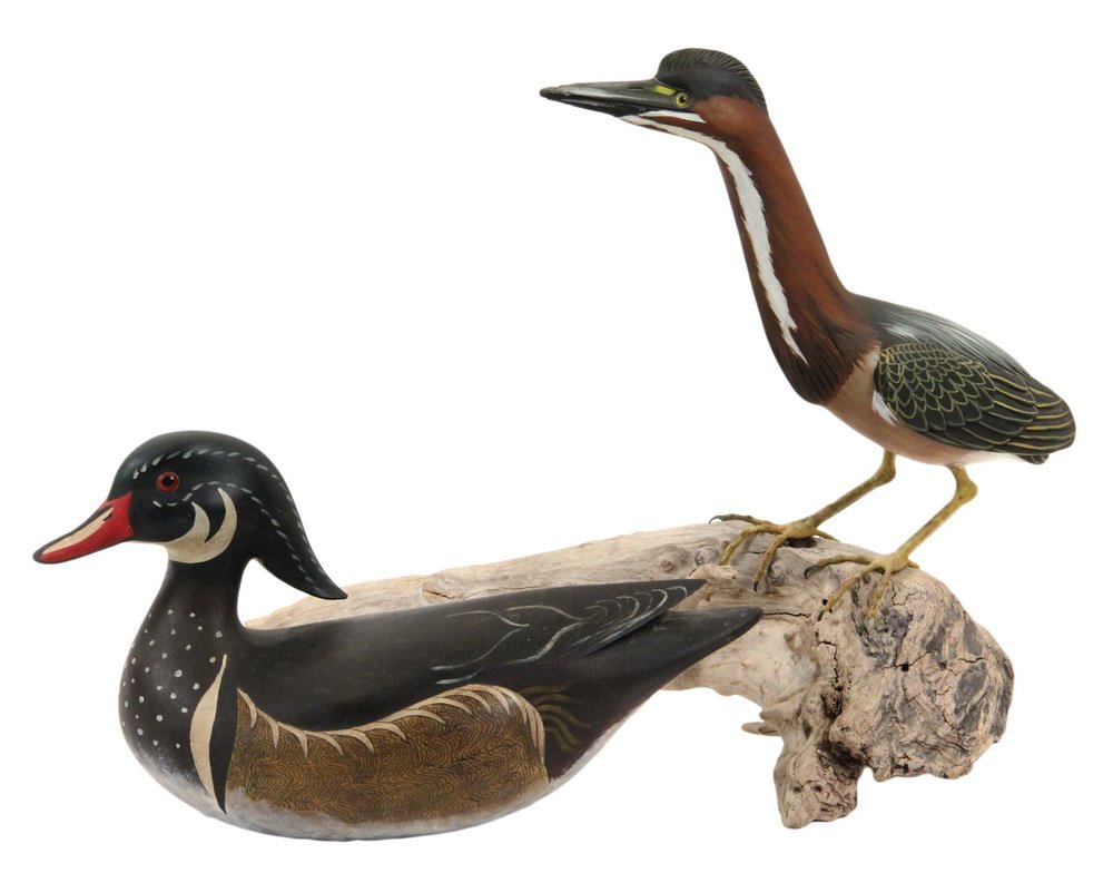 (2) DISPLAY BIRD DECOYS - "Lil Green Heron" by Steve: (2) DISPLAY BIRD DECOYS - "Lil Green Heron" by Steve Hutchens, 1982, signed on underside, the well painted bird mounted on a bit of driftwood, 12" long bird, about 18" long overall, 13 1/4" tall, dama