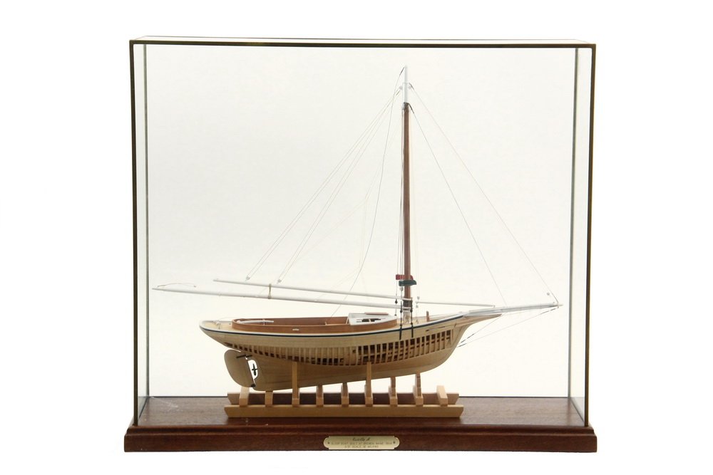 CASED SHIP MODEL - "'Estella A', Sloop Boat, Built at: CASED SHIP MODEL - "'Estella A', Sloop Boat, Built at Bremen, Maine, 1904. 3/8" scale, M. Wilkins", (Mark Wilkins). On molded mahogany base with brass and glass case. 18 3/4" x 24 3/4" x 7 3/4". Fine