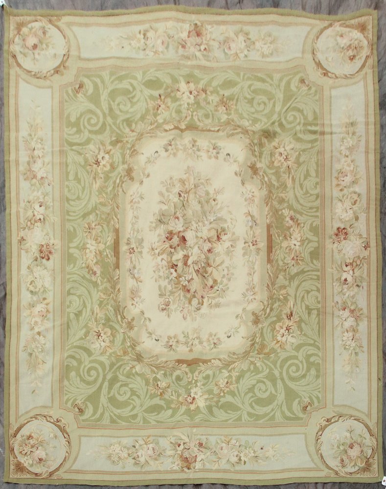 AUBUSSON STYLE NEEDLEPOINT CARPET - 8' x 10' - France,: AUBUSSON STYLE NEEDLEPOINT CARPET - 8' x 10' - France, 2nd quarter 20th c, the central bouquet of realistically drawn flowers set inside an ivory panel surrounded by floral groups and blossoming vines