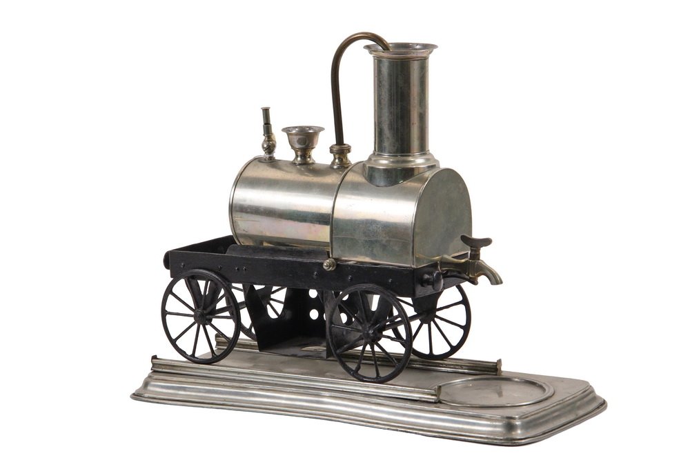 WHIMSICAL COFFEE BREWER - Early Railroad Locomotive: WHIMSICAL COFFEE BREWER - Early Railroad Locomotive Form 'Live Steam' Espresso Maker, circa 1880, nickel plated, on a black painted carriage, plated base, having a relief valve mounted with a working