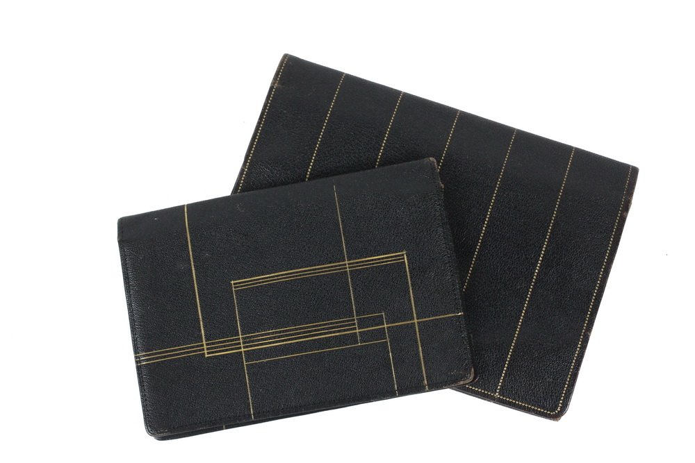 JOSEF HOFFMANN (Austria, 1870-1956); WIENER WERKSTATTE: JOSEF HOFFMANN (Austria, 1870-1956); WIENER WERKSTATTE (Vienna, 1903-1932); Gilt Black Leather Clutch Purse with Lift-Out Wallet, in matching linear decoration, Austria, ca. 1910, gilded and embossed
