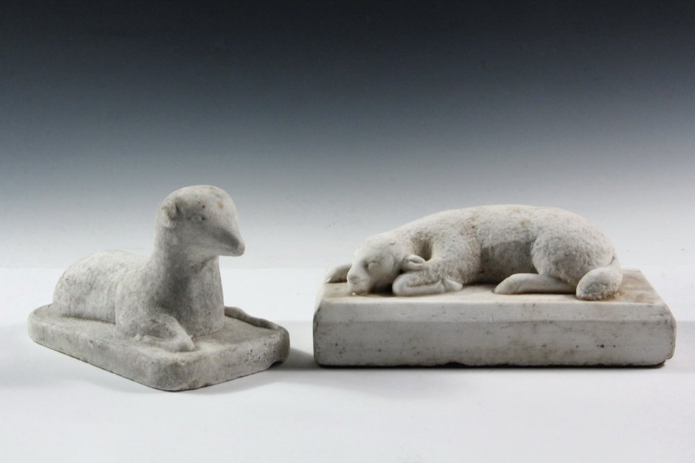 (2) SMALL MARBLE SCULPTURES - Mourning Figures of: (2) SMALL MARBLE SCULPTURES - Mourning Figures of Reclining Lambs of God, 19th c or earlier, one with head on ground, on rectangular base, 4" x 10" x 4 1/2"; the other with head up, on oblong base, 5"