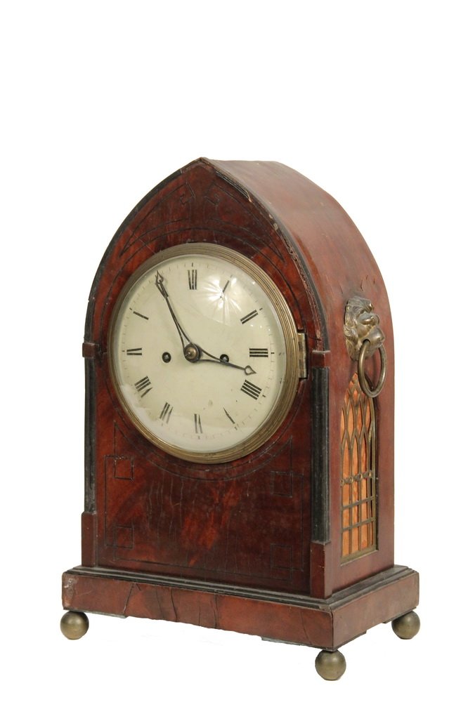EARLY ENGLISH CATHERDRAL CLOCK - Late 18th c. Mantel: EARLY ENGLISH CATHERDRAL CLOCK - Late 18th c. Mantel Clock in mahogany with ebony inlay, brass lion head bosses with drop ring bails on sides, arched cloth backed vent with brass mullions below, origi