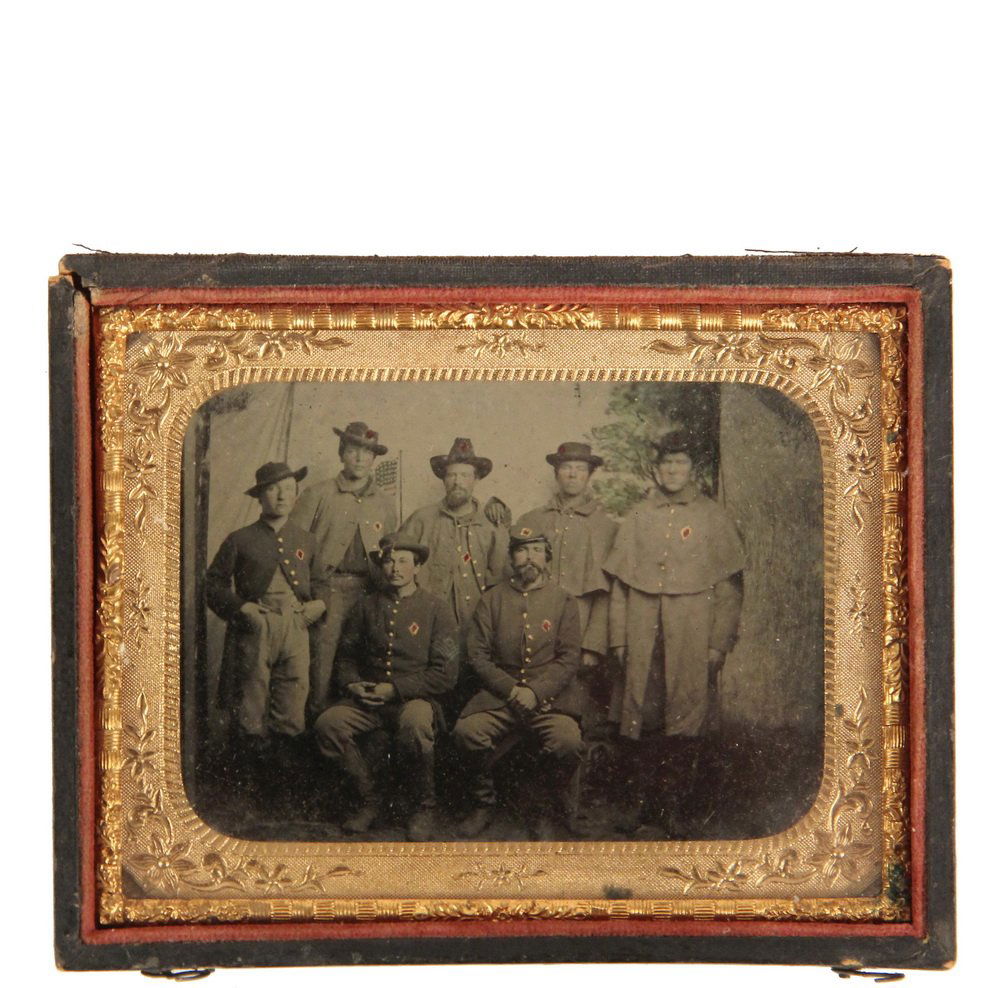 CIVIL WAR PHOTOGRAPH - Hand Colored Tintype of Seven: CIVIL WAR PHOTOGRAPH - Hand Colored Tintype of Seven Union Soldiers in Winter Garb, taken in studio in front of painted camp backdrop, in leather case (hinge separated), sixth-plate, under glass with