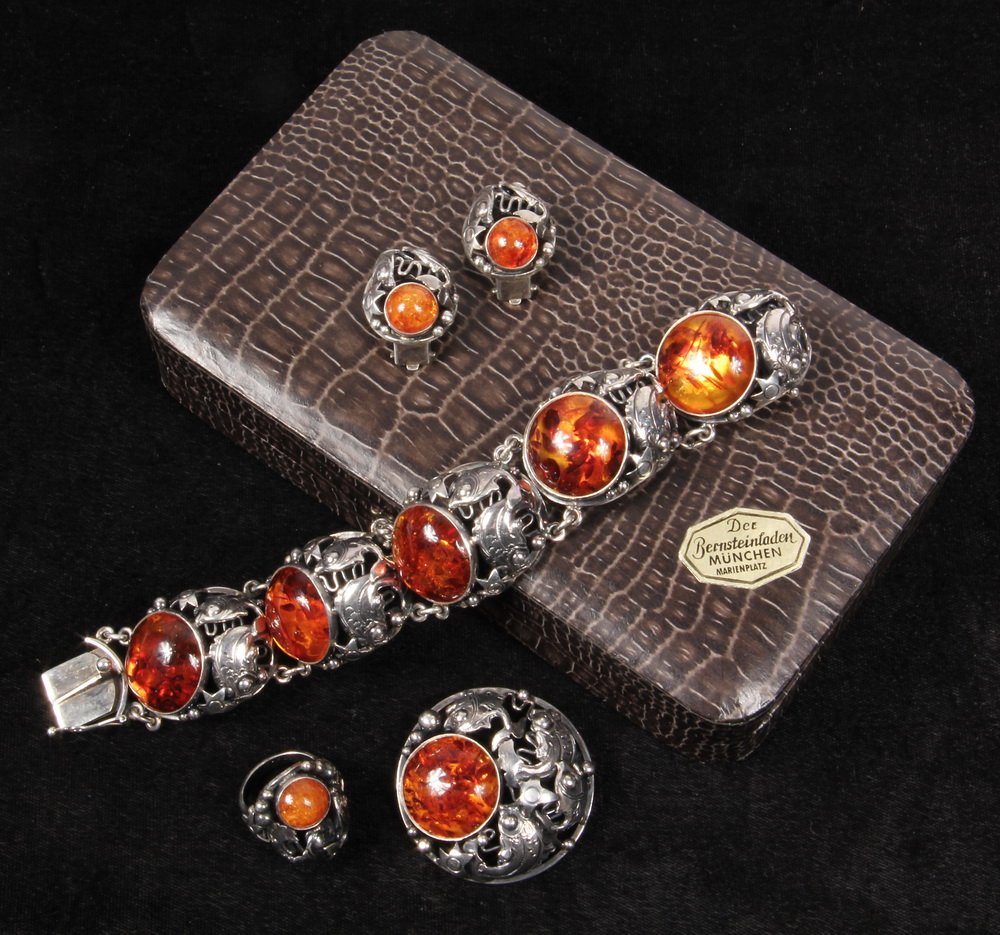JEWELRY SUITE - (4) piece Vintage Handmade Sterling and: JEWELRY SUITE - (4) piece Vintage Handmade Sterling and Amber set includes a bracelet, round brooch, a pair of earclips and ring in a fish pattern, marked by maker NE From Denmark, 3 ozt tw, 1" x 7" b