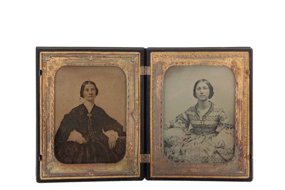 HALF PLATE UNION CASE WITH AMBROTYPES - Circa 1850: HALF PLATE UNION CASE WITH AMBROTYPES - Circa 1850 Portraits of Two Women, in a magnificent thermoplastic case depicting a utopian haying scene, with a young boy running towards the farmhouse, his hat