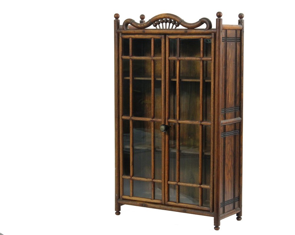 OAK WALL CABINET - Stick and Ball Golden Oak Cabinet: OAK WALL CABINET - Stick and Ball Golden Oak Cabinet with glass doors over two adjustable shelves, having grooved panel sides, black and brass pull, 30 1/4" x 18" x 7 1/2", good condition.